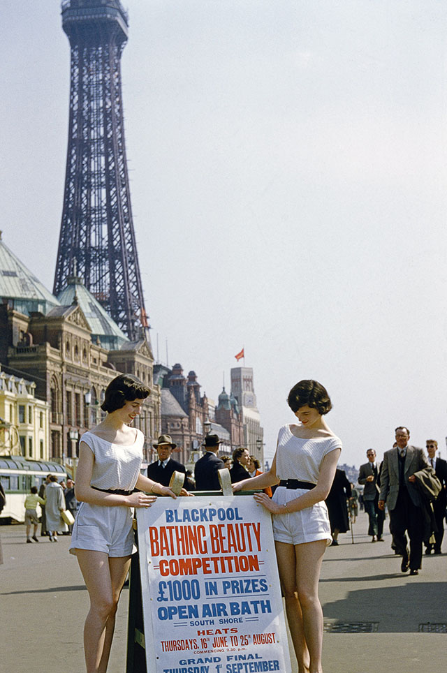 Two women with a sign advertising a bathing beauty contest, on the promenade at Blackpool, Lancashire, July 1954. Blackpool Tower is in the background. Original publication: Picture Post - 7227 - Blackpool - pub. 31st July 1954 (Photo by John Chillingworth/Picture Post/Hulton Archive/Getty Images)